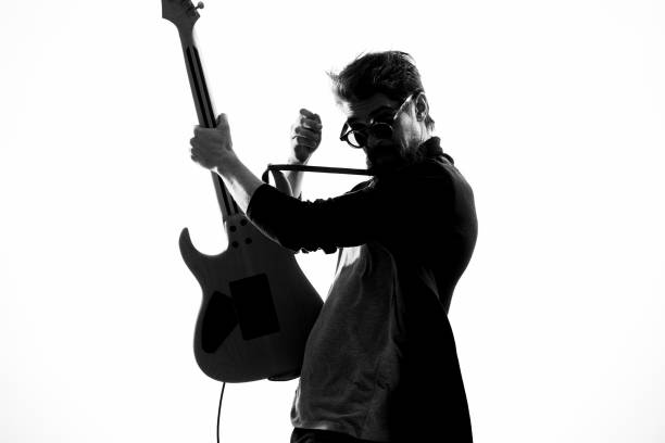 istock Man with guitar music performance entertainment contemporary performer sunglasses studio 2104472237