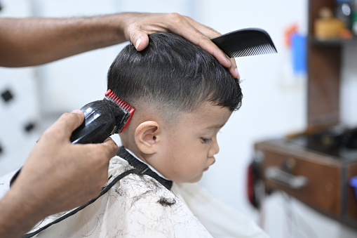 Little boy in the hair salon