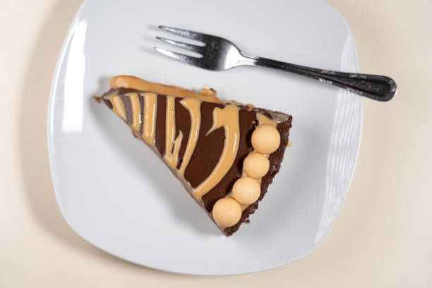 istock Piece of Salted Caramel Chocolate Cold Cake 2104501396