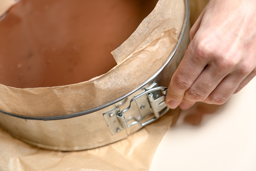 Springform pan with cake after chill and ready to decorate. Cooking Salted Caramel Chocolate Cold Cake Series.