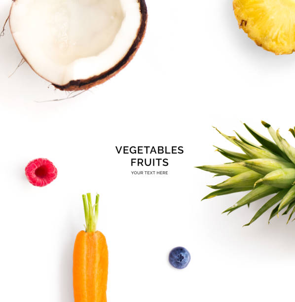 Creative layout made of carrot, coconut, raspberry and blueberry. Flat lay. Food concept.