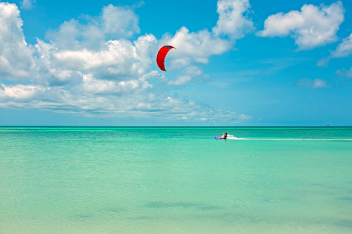 Kite surfing at Palm Beach on Aruba island in the Caribbean Sea