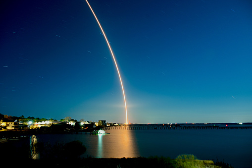 NASA Space Shuttle Atlantis moving through a cloud after launch