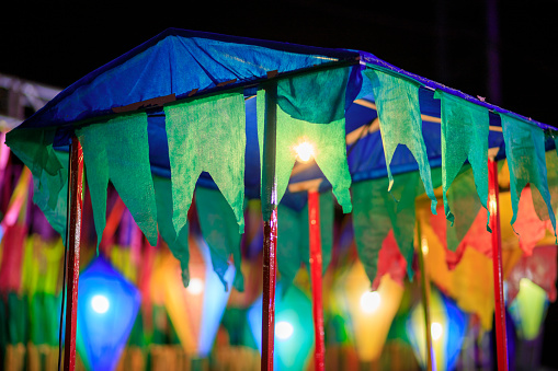 festa junina - canvas tent decorated with colorful flags and decorative balloons