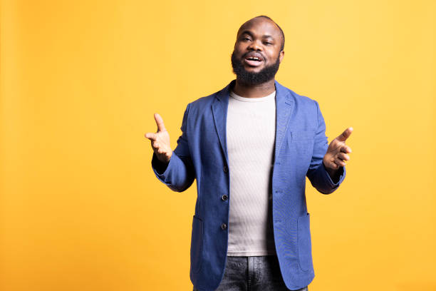 istock Portrait of lecturer doing monologue and gesturing with hands, studio background 2104580682
