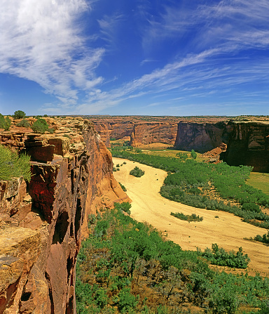 Canyon de Chelly National Monument, Arizona, USA - vertical ochre-colored rock faces falling into the canyon