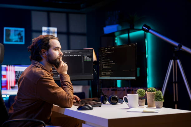 istock Programmer writing lines of code filtering malicious traffic from cybercriminals 2104600489