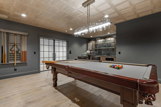 istock Interior photographs of a luxurious residential home den study dining room kitchen living room bedroom bathroom walk in closet glass shower butler pantry grand piano pool table and a grand fireplace. 2104604792