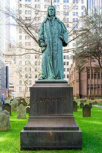 Trinity Church in the heart of the Wall Street Financial district of Manhattan.  In the cemetery is the tomb for Alexander Hamilton and a large statue of John Watts Jr, Created by George Edwin Bissell (February 16, 1839 – August 30, 1920).