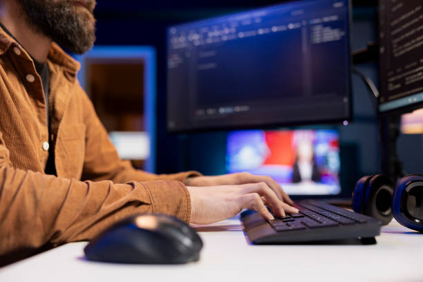 istock Expert writing code to build firewalls protecting company data, close up shot 2104616939