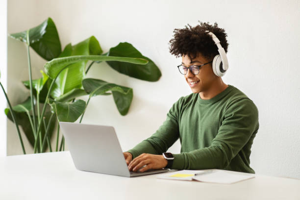 istock Cheerful young guy have online meeting with colleagues 2104631776