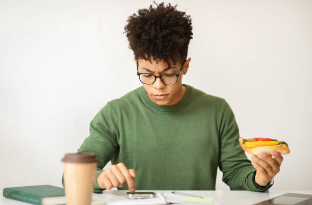 istock Black guy freelancer have lunch break at cafe 2104632881