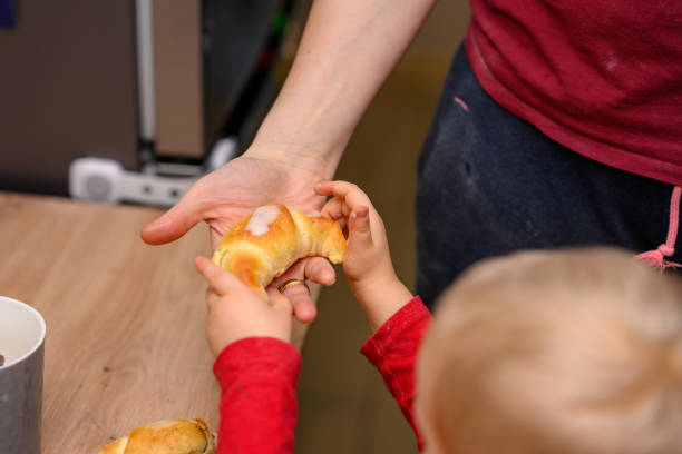 Decorating croissants with child