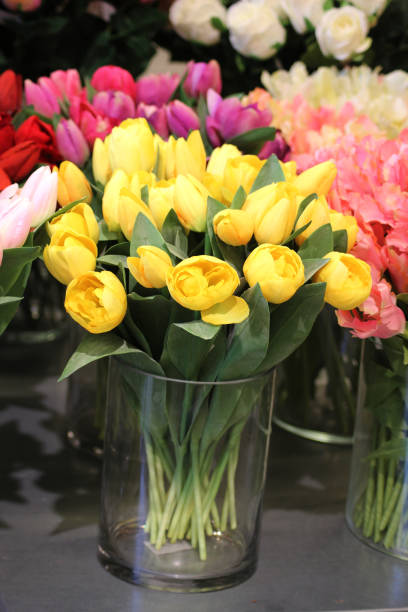 istock A vase with beautiful fresh yellow tulips 2104653025