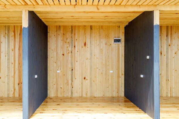 istock A large empty room with wooden walls and a black ceiling 2104683699