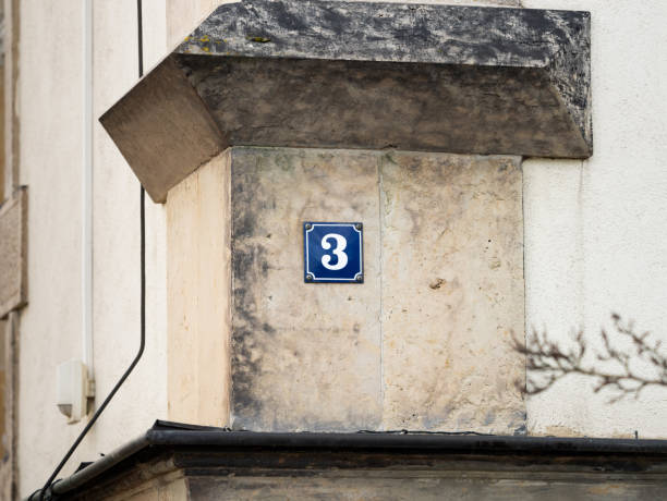 istock Number 3 Sign on an Exterior House Wall 2104684776