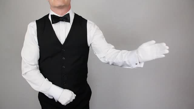Classic Butler or Waiter With Welcoming Gesture