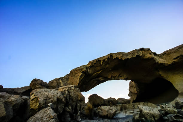 istock Natural Arch in the Desert 2104706798