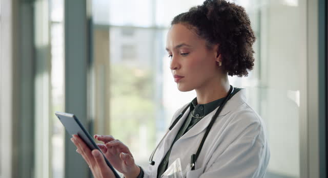 Woman, reading and medical doctor with tablet, research in hospital for health care diagnosis on technology. Browsing, information and web search with results, review and analysis with agreement