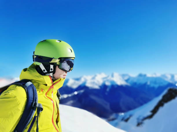 istock Smiling Skier with Reflective Goggles and Helmet 2104756271