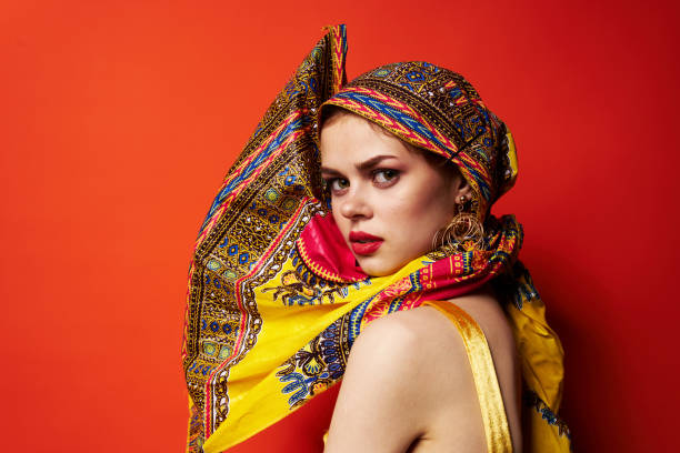 istock cheerful woman multicolored headscarf red lips oriental style red background 2104776193