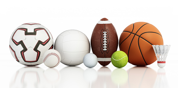 top view of balls for soccer, basketball, tennis, baseball and american football on grass pitch