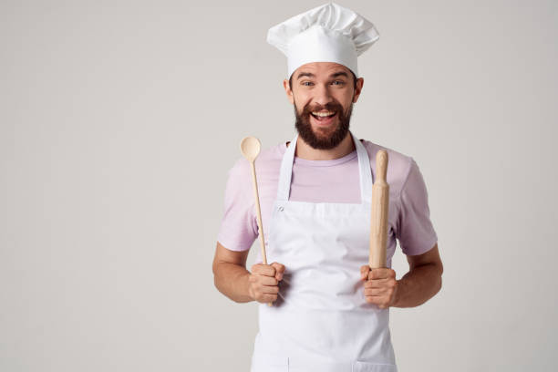 istock male chef in uniform cooking professional cooking 2104871250
