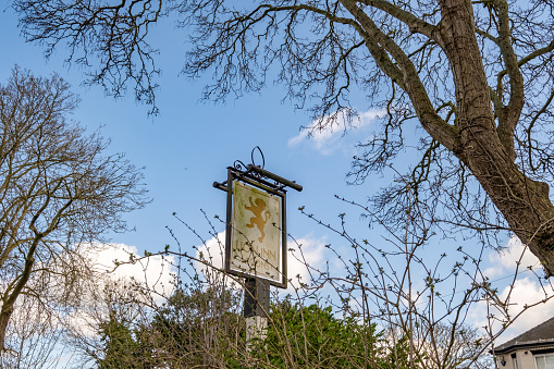 Thurne, Norfolk, UK  March 16 2023. The exterior sign of the Lion pub, a public house in the Norfolk Broads