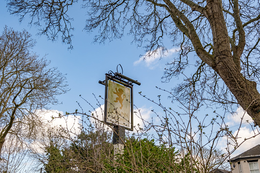 Thurne, Norfolk, UK  March 16 2023. The exterior sign of the Lion pub, a public house in the Norfolk Broads