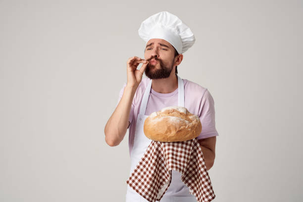 istock male baker with fresh bread in his hands cooking baking 2104883795