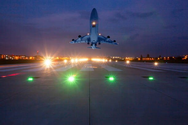 istock Passenger airplane is taking off at dusk 2104886938