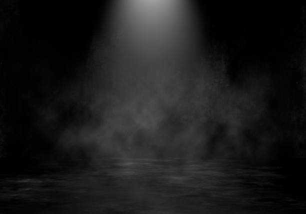istock A spotlight of light coming from above in a smoky environment 2104890563