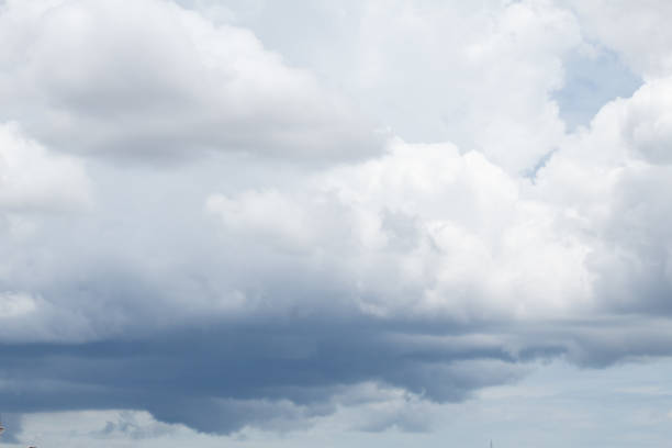 Image of cloudy sky with dense clouds, an indigo blue color.