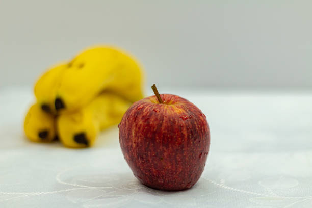 banana and apple isolated on white background