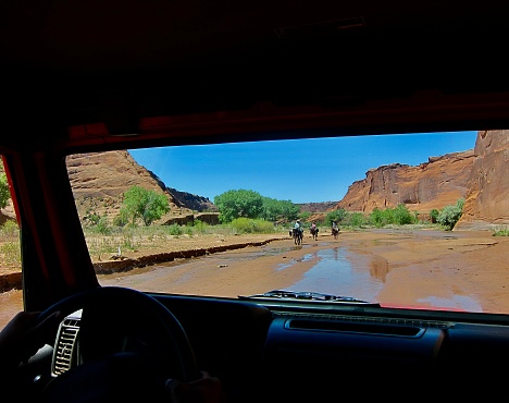 We took an off-road jeep tour through the beautiful Canyon de Chelly valley in spring. Chinle Creek is a tributary stream of the San Juan River in Apache County, Arizona. Its name is derived from the Navajo word ch'inili meaning 'where the waters came out'. Jeep tours and horseback riding must be conducted by a Navajo Guide - highly recommended. Canyon de Chelly National Monument is in Chinle, northeastern Arizona on Navajo tribal lands.