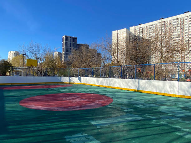 street basketball court in park after rain at day sunny day stock photo