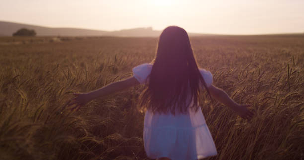 istock child in field of wheat 2105090487
