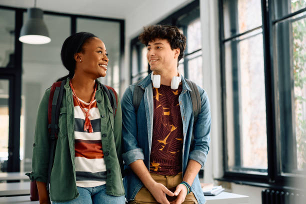 istock Happy multiracial college friends talking in the classroom. 2105097906