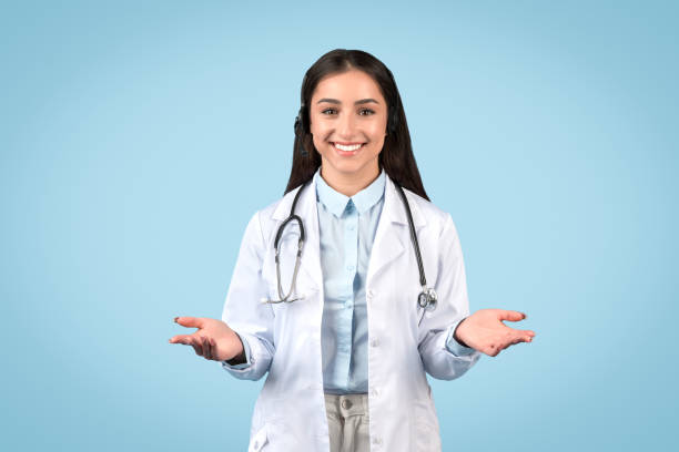 istock Inviting female doctor with open hands on blue background 2105142892