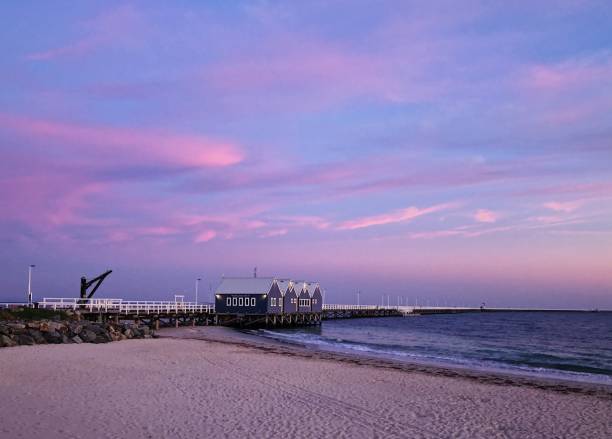 istock a beach area with a pier and a blue sky above 2105165575