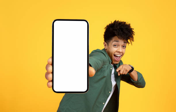 istock Emotional guy holding big smartphone with white blank screen 2105198261