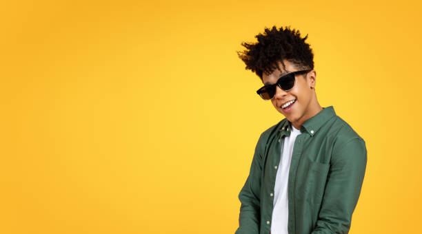 istock Stylish young african american guy wearing sunglasses 2105198271