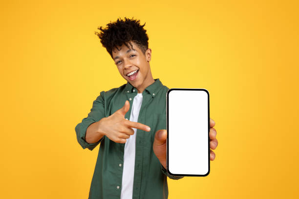 istock Positive black guy showing smartphone with white blank screen 2105198272