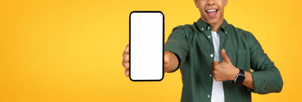 istock Cropped of black guy showing smartphone with white blank screen 2105198283