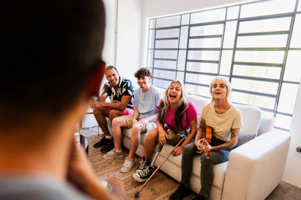 istock Young friends talking at home 2105218391