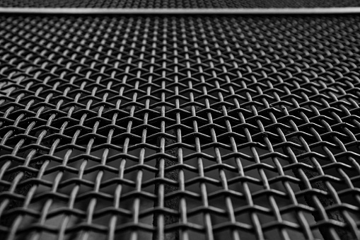 Close-up of a grate with a pattern of intertwined iron wires, Italy