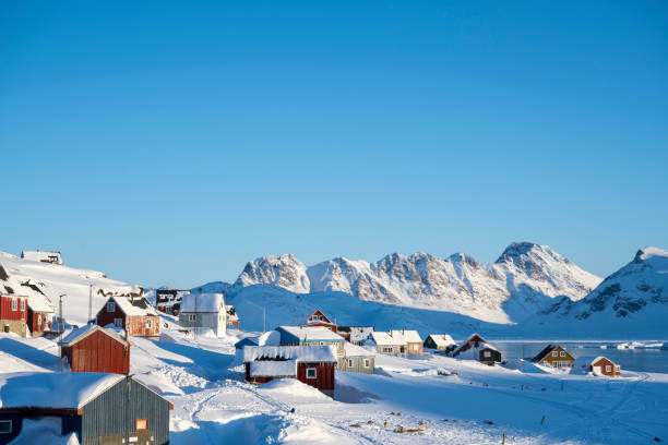 istock Community on a frozen bay and mountains 2105315829