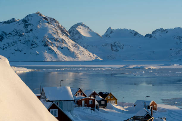 istock Community on a frozen bay and mountains 2105315830