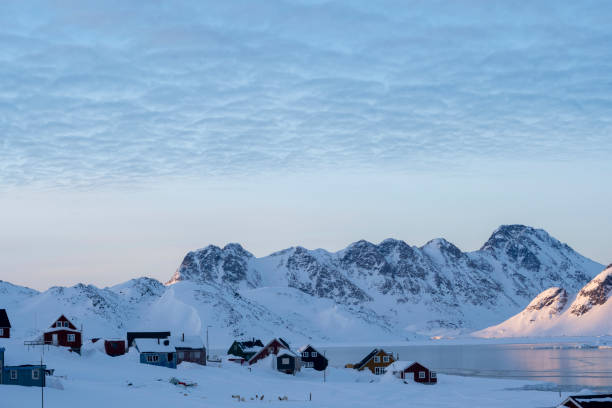 istock Community on a frozen bay and mountains 2105316884