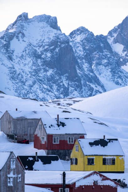 istock Community and snowcapped mountain at twilight 2105318572